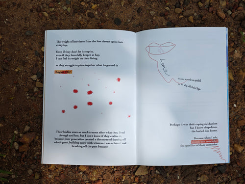 Open spread on red earth — text and illustrations reflecting on ancestral memories, with red paint marks and a hand-drawn figure