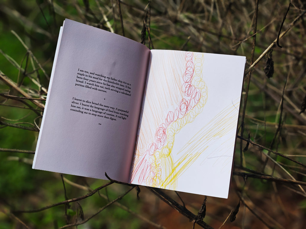 Open spread in branches — left page with text about watching father eat bread with sorrow, right page with red and yellow scribble illustration