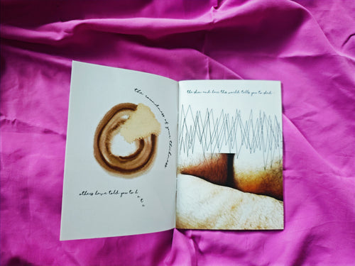 Open spread on pink fabric — coffee ring illustration with curved handwritten text about the weight of thickness, alongside photograph of body hair with zigzag pencil drawing overlay